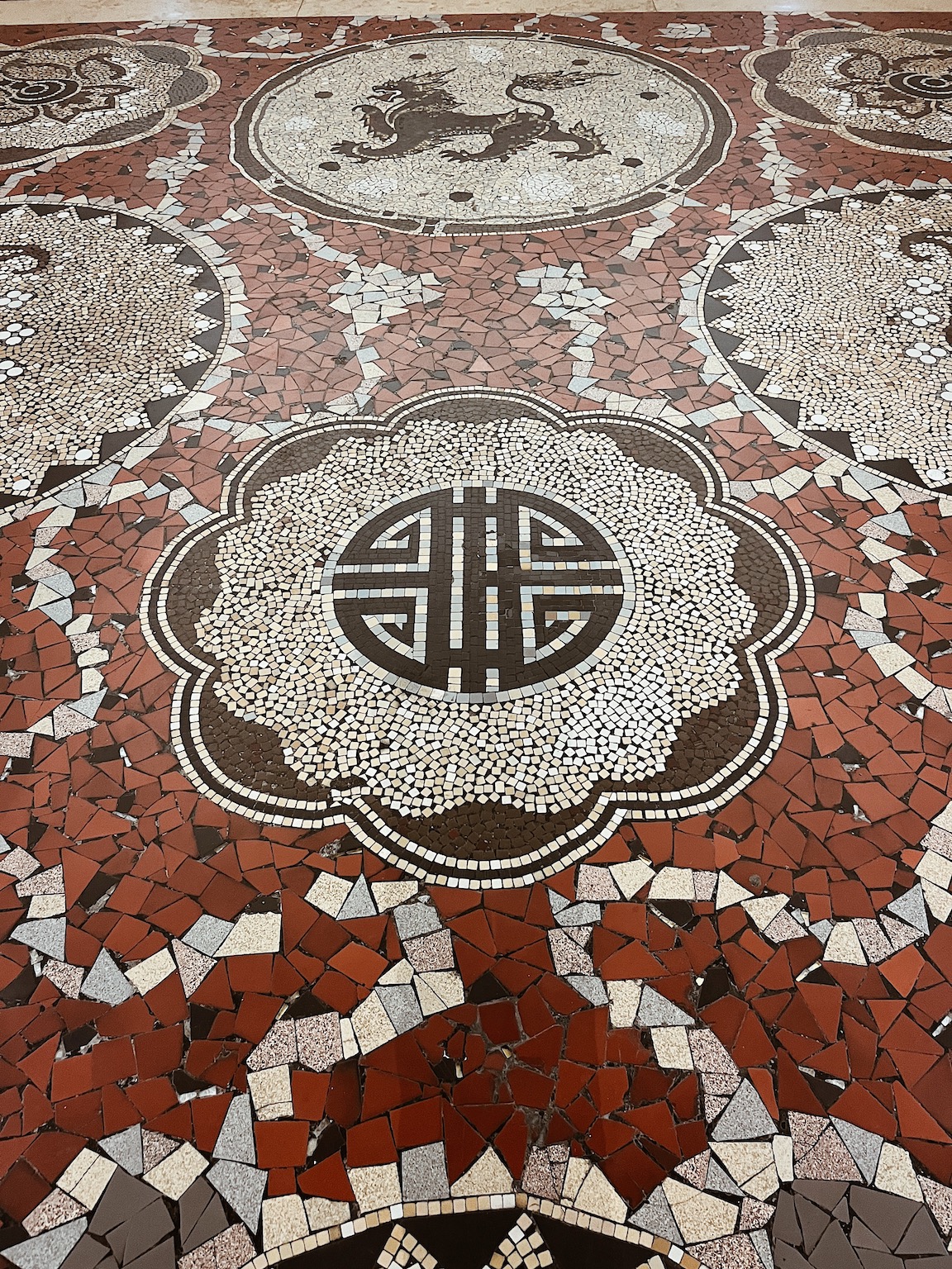 Photography of the mosaic patterns of the ground of the Immigration History Museum.
